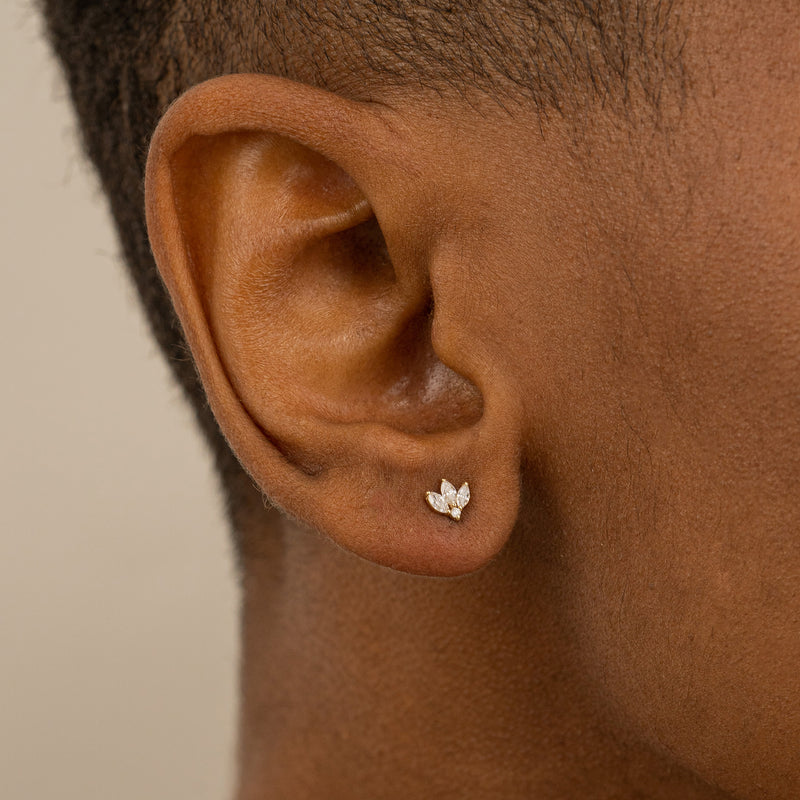 Model wears Dainty Three Marquise Diamond Stud earring in 14k solid gold