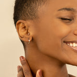 Model wears Minimalist Handmade single bezel Aquamarine Huggies for her