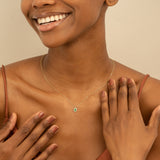 Oval Emerald and Round Diamonds Pendant