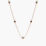 handcrafted solid rose gold necklace with natural black diamond station bezels