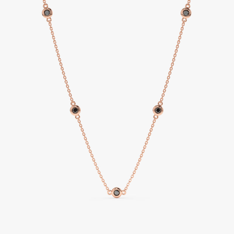 handcrafted solid rose gold necklace with natural black diamond station bezels