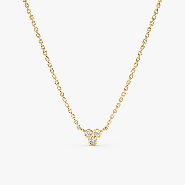 Minimalist gold necklace with three diamonds