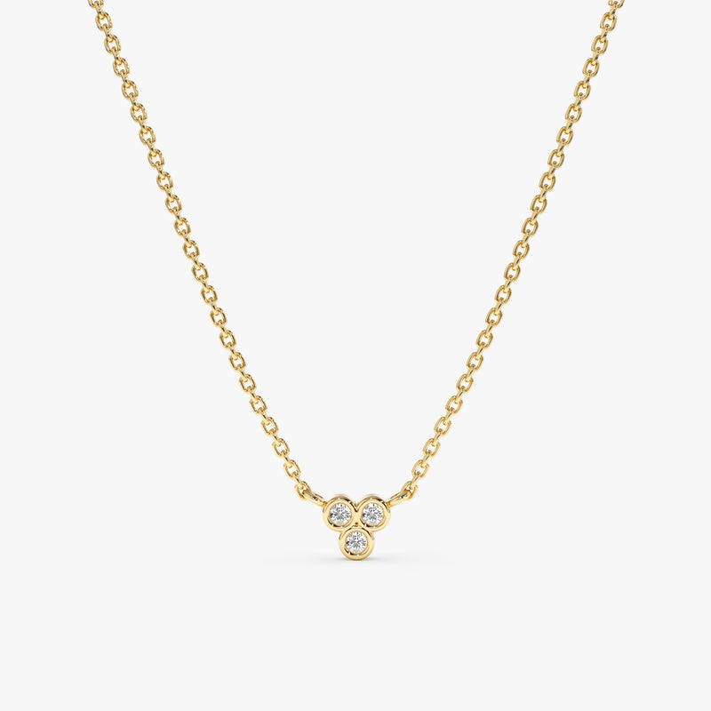 Minimalist gold necklace with three diamonds
