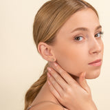 model wears dainty Diamond Evil Eye Studs