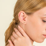 model wears dainty Natural Diamond Gold Flower stud Earrings