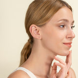 Model wears Heart Key Earrings with Diamonds