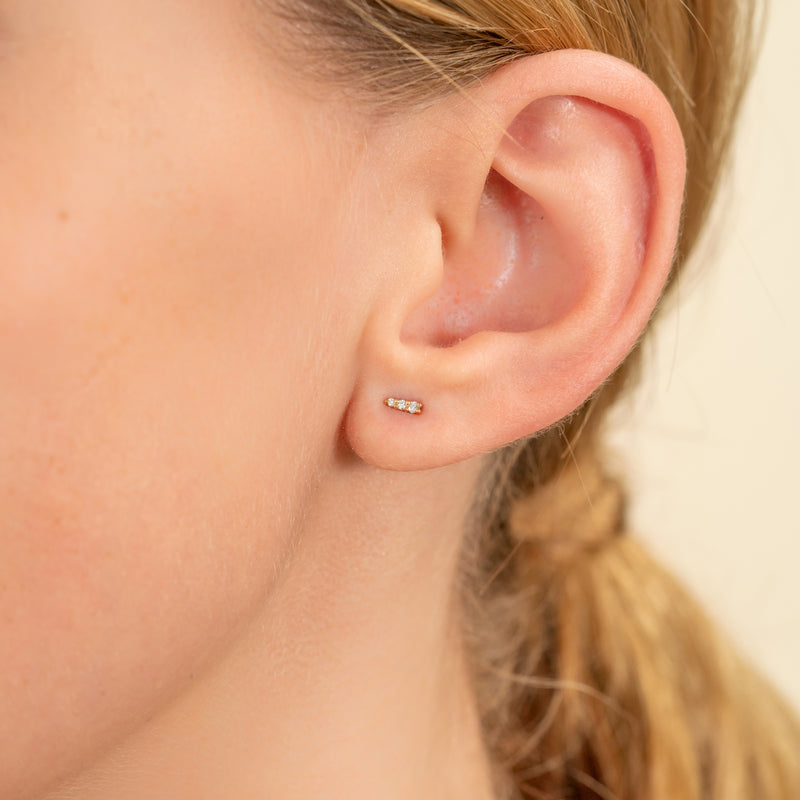 model wears Handmade Petite Diamond Earrings in spike shape 