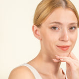 Model wears dainty solid 14k gold multi diamond cluster stud earring