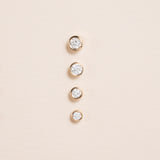 multiple sizes of Petite Diamond bezel Gold Stud Earrings