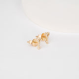 Pair of solid 14k gold stud earrings in key and heart shape