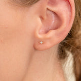 handcrafted dainty eye shape stud earrings with single diamond