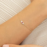 minimalistic design handmade ruby evil eye bracelet