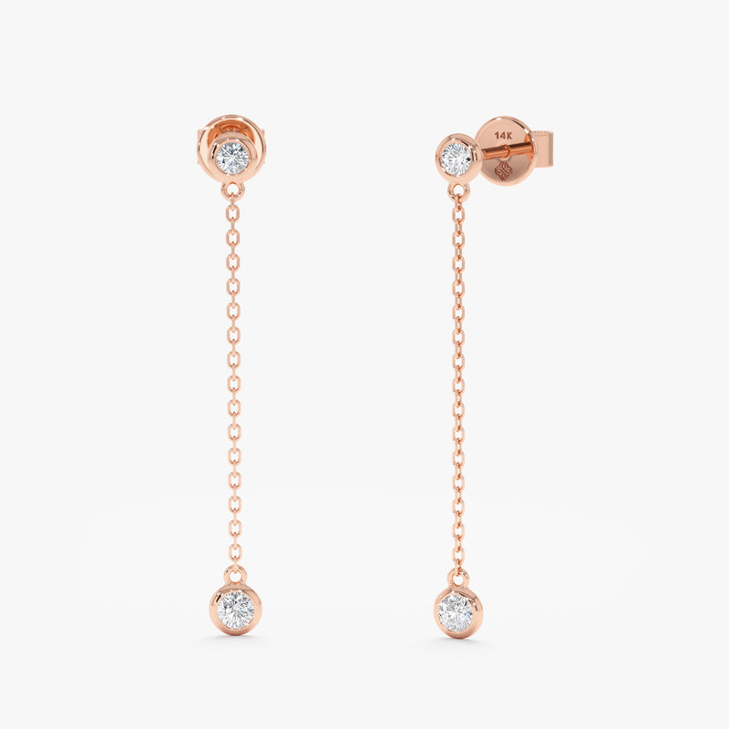 Pair of solid 14k rose gold long hanging diamond bezel earring studs