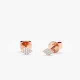 handcrafted pair of solid 14k rose gold diamond shape stud earrings with paved diamonds