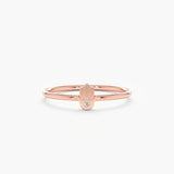 Rose gold hamsa ring with a single diamond