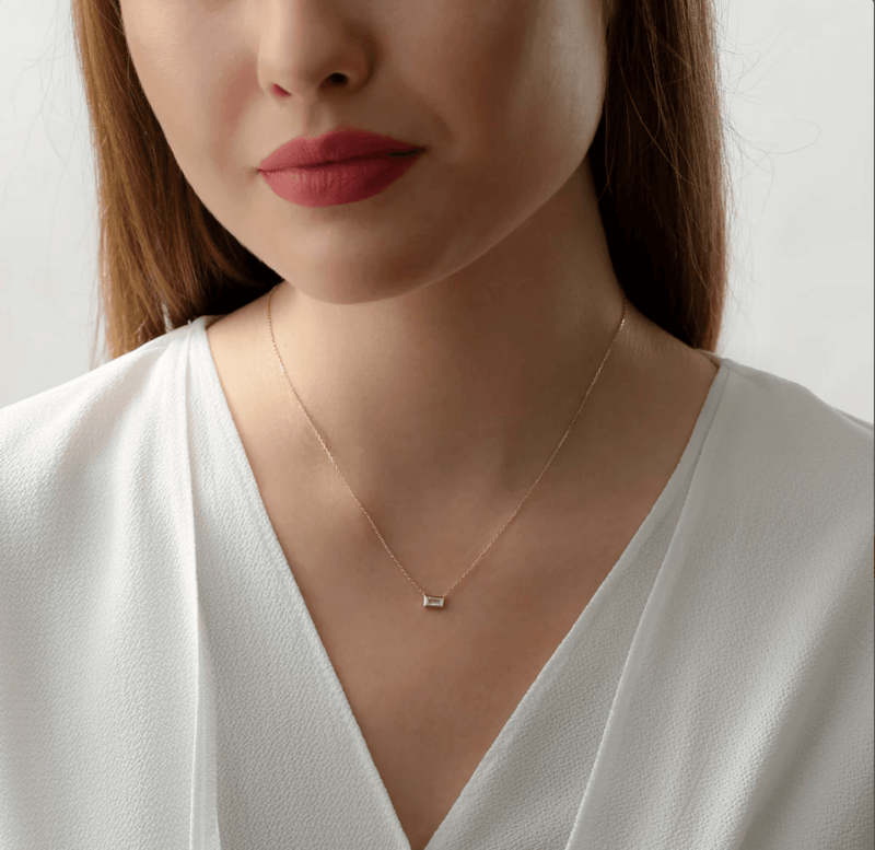 Dainty moonstone pendant necklace on a gold chain