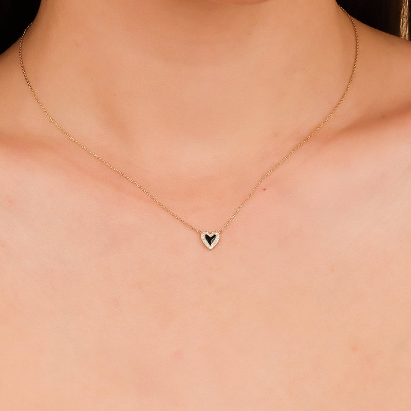 Two-tone heart necklace with black enamel and pave diamonds in solid gold.