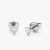 handcrafted pair of solid 14k white gold stud earrings with pear cut diamond