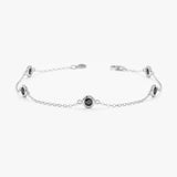 Dainty black diamond station bracelet in white gold 