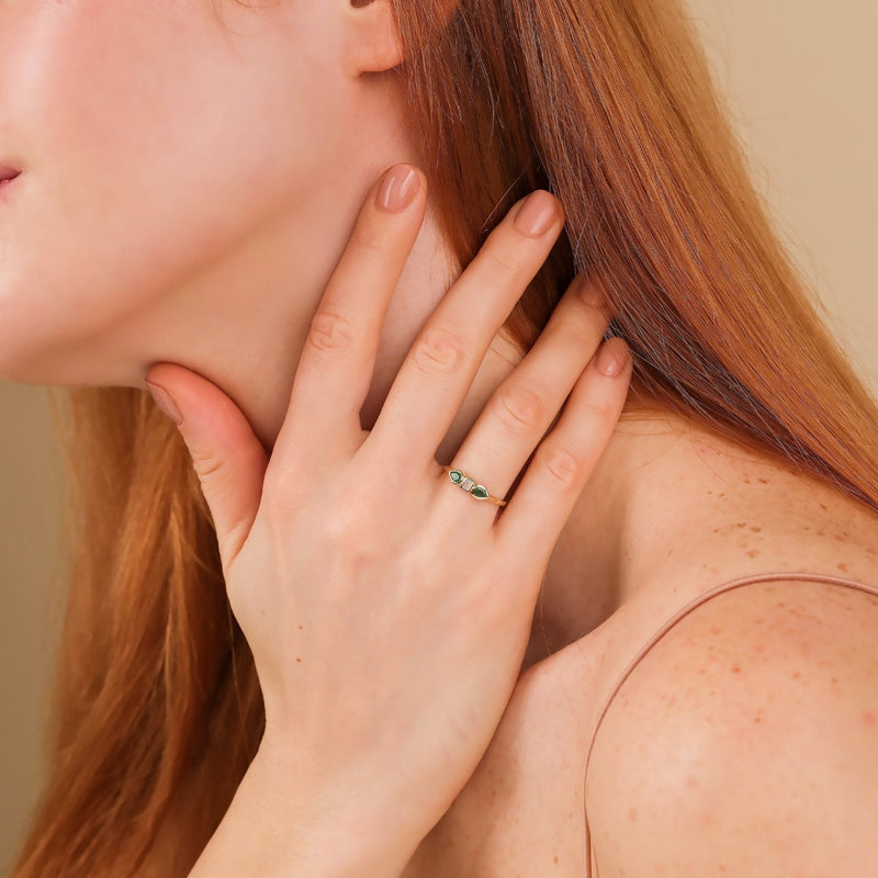 baguette diamond pear emerald ring