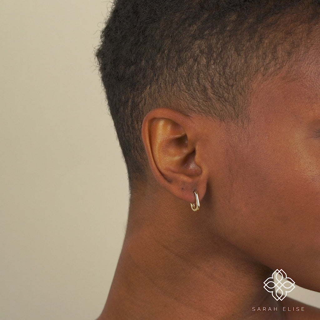 Video close up of Simplistic solid Gold U shape Hoop Earrings