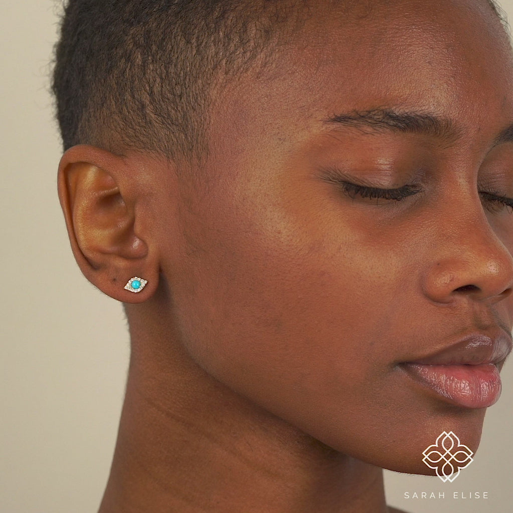Video close up of model wearing Diamonds Turquoise Lucky Eye Studs for her