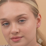 Video close up of minimalist single Blue Sapphire Huggies for her