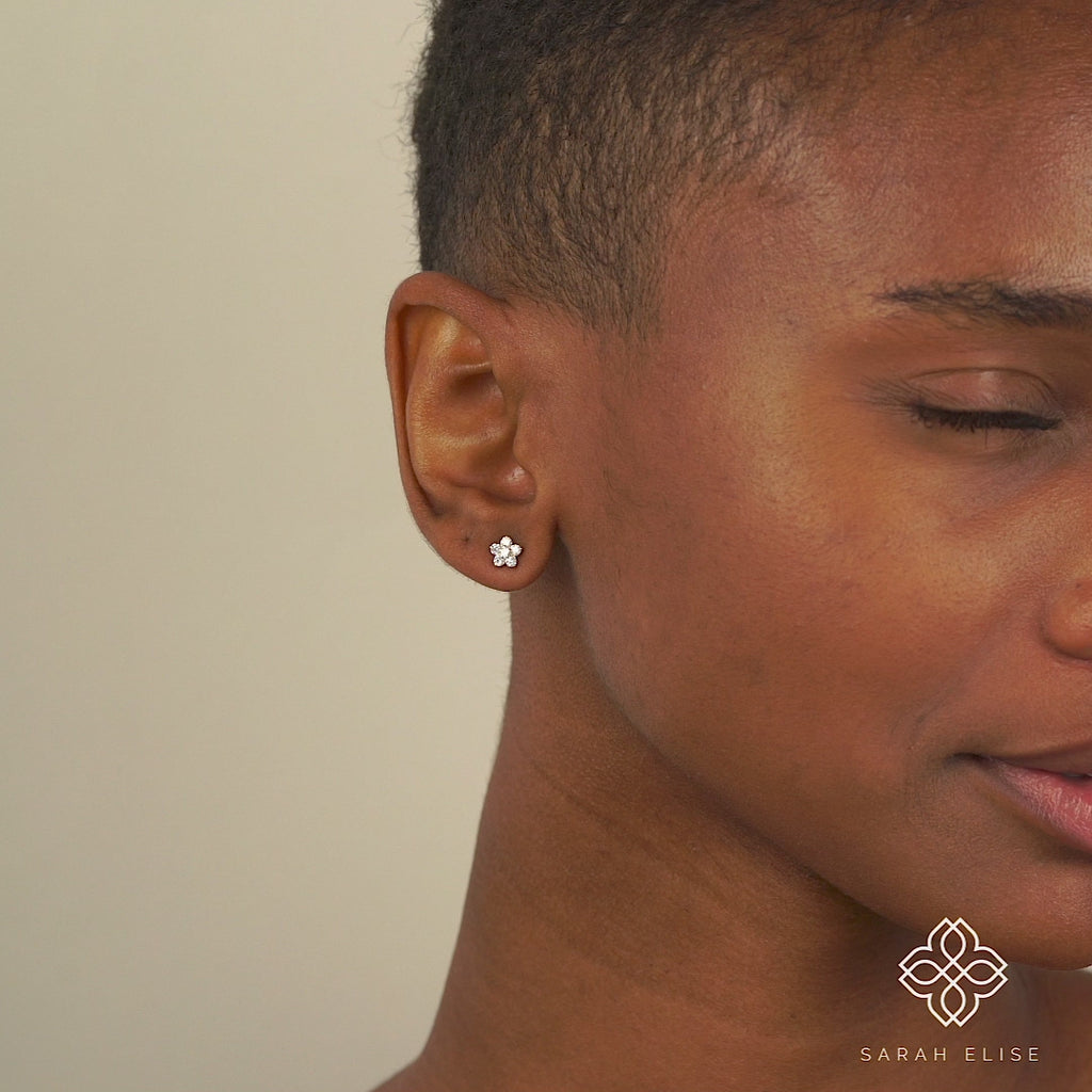 Video close up of minimalist natural Diamond Flower Stud earrings