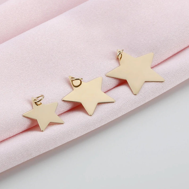 minimalistic star necklace charms in solid gold and various sizes