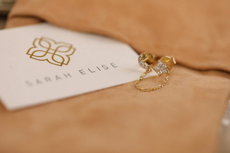 dainty gold and diamond moon and star chain stud earrings