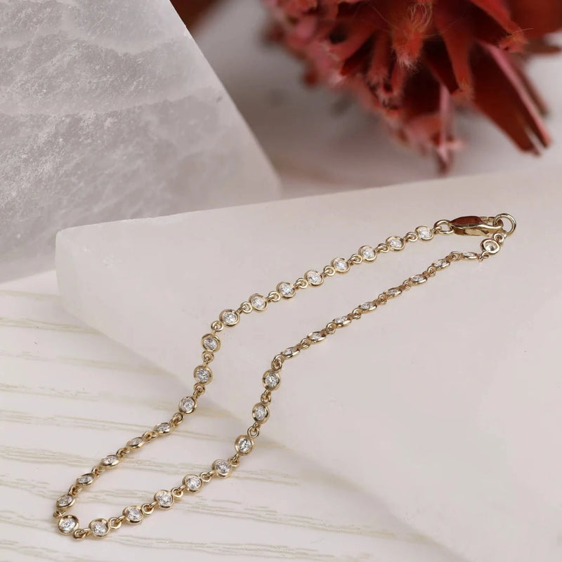 solid gold minimalistic bezel diamonds tennis bracelet