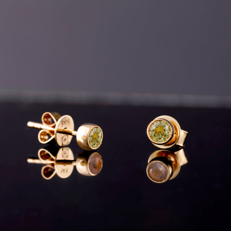 dainty pair of Peridot August Brithstone Earrings in solid gold