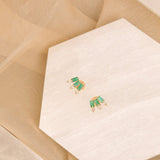 Pair of may birthstone triple emerald baguette stud earrings with three diamond prong in solid gold 